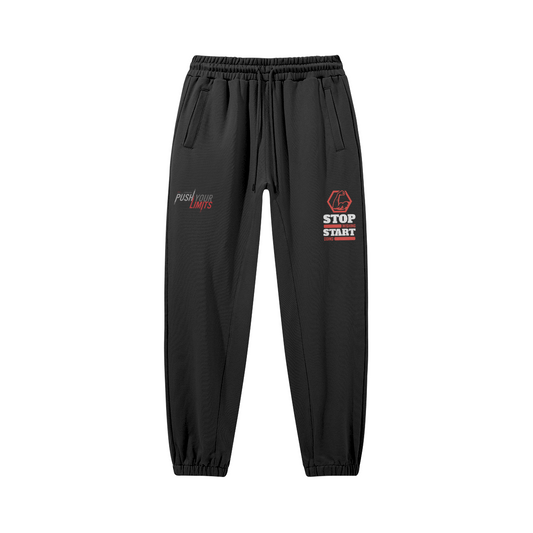 Schwarze Jogginghose mit STOP WISHING START Frontprint und Kordelzug aus 100% Baumwolle